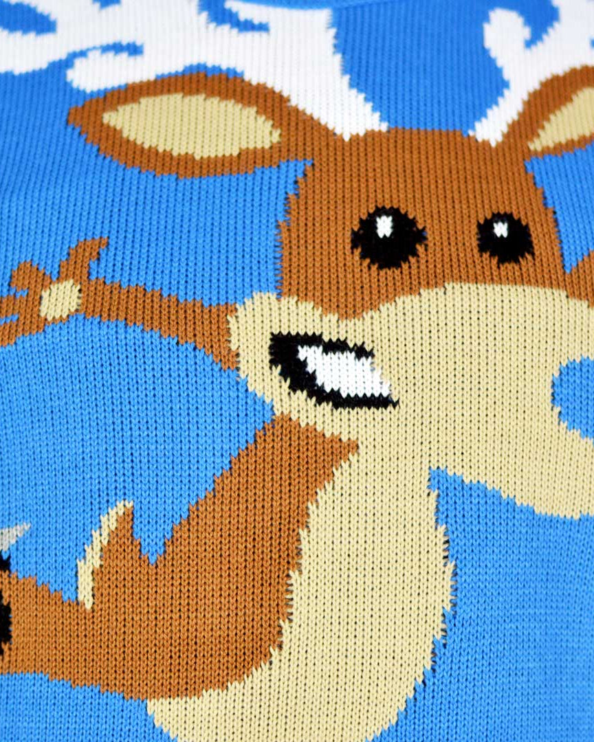 detail Light Blue Couple's Christmas Jumper with skating Reindeer